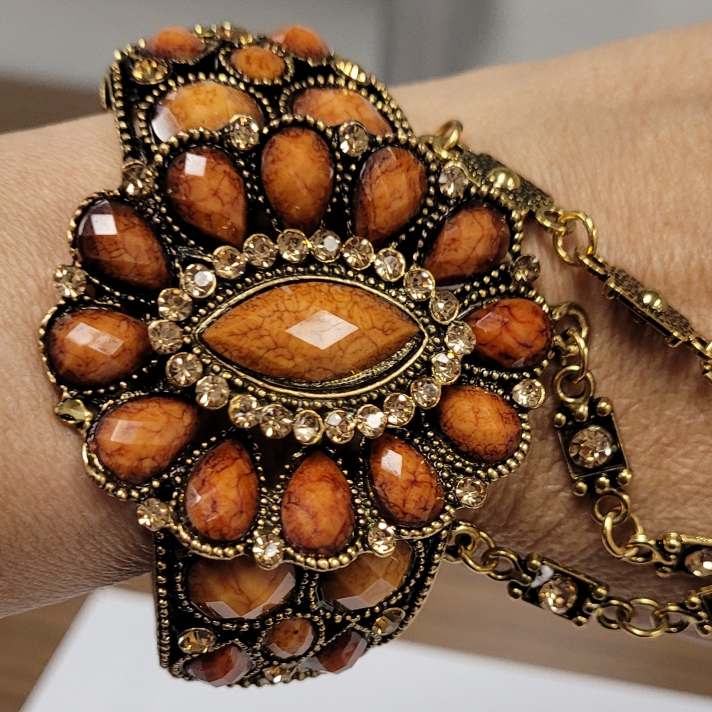 Amber and gold colored stoned hand bracelet